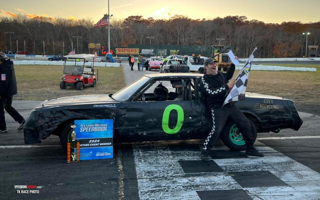 Black and white abstract pattern with concentric circles and wave shapes.