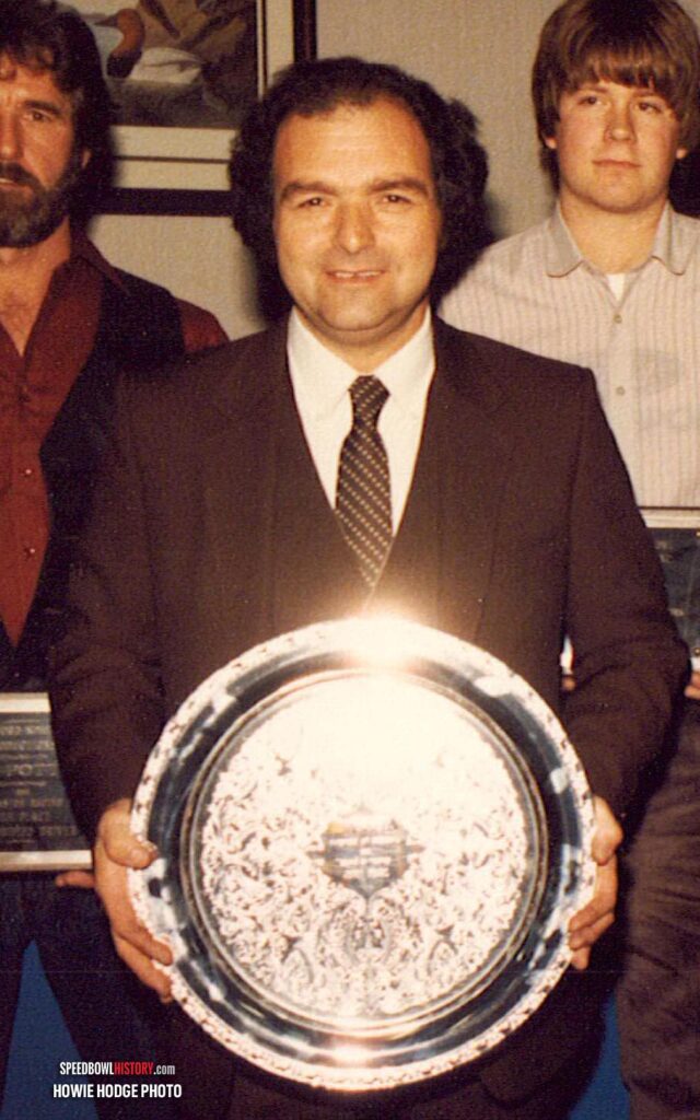 Black and white abstract pattern with concentric circles and wave shapes.