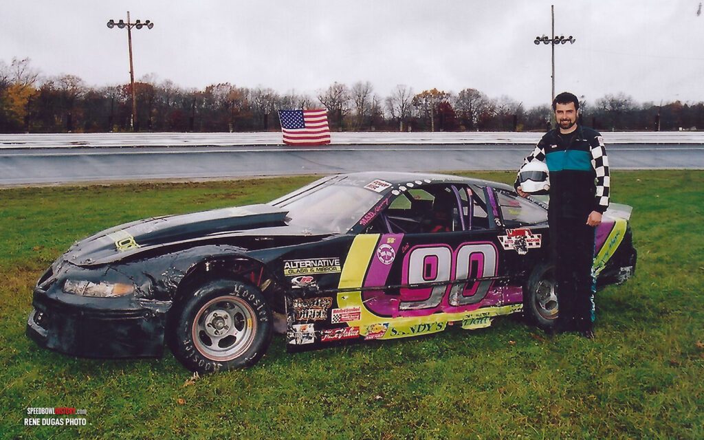 Black and white abstract pattern with concentric circles and wave shapes.