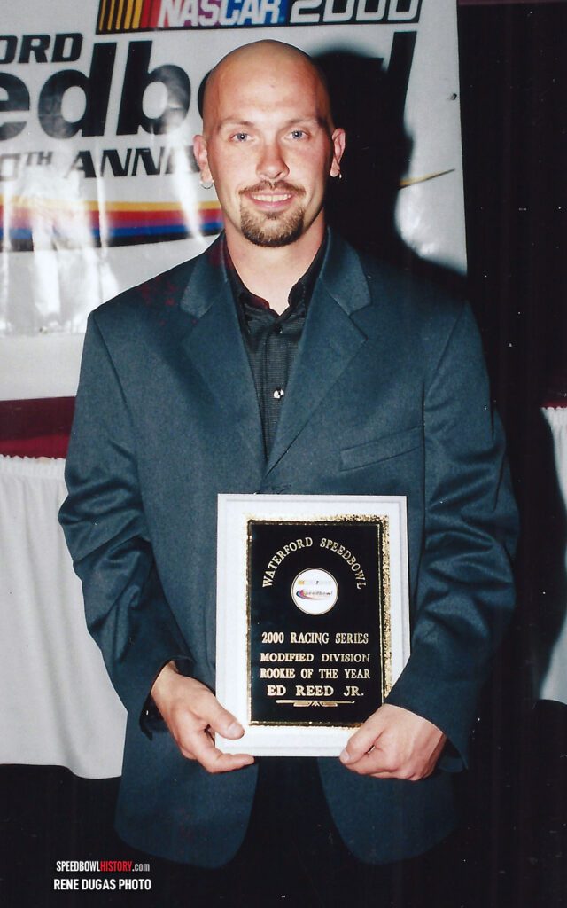 Black and white abstract pattern with concentric circles and wave shapes.