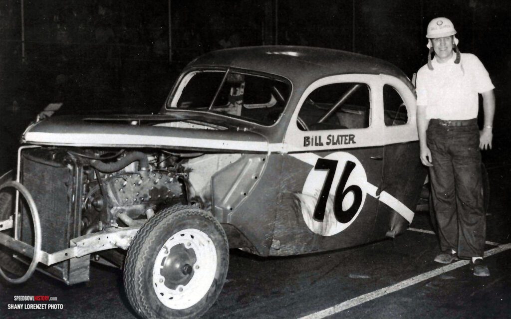 Black and white abstract pattern with concentric circles and wave shapes.