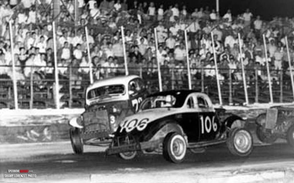 Black and white abstract pattern with concentric circles and wave shapes.