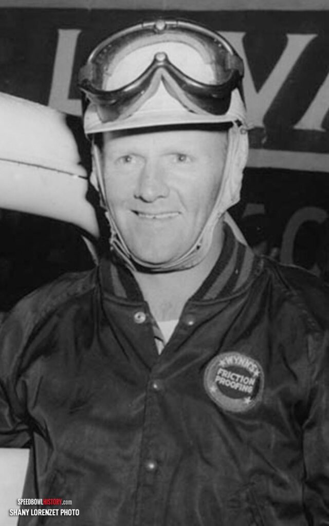 Black and white abstract pattern with concentric circles and wave shapes.