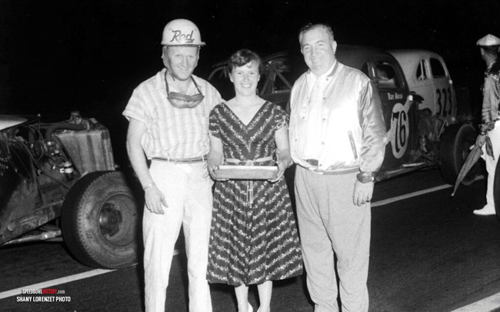 Black and white abstract pattern with concentric circles and wave shapes.