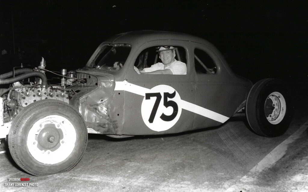 Black and white abstract pattern with concentric circles and wave shapes.