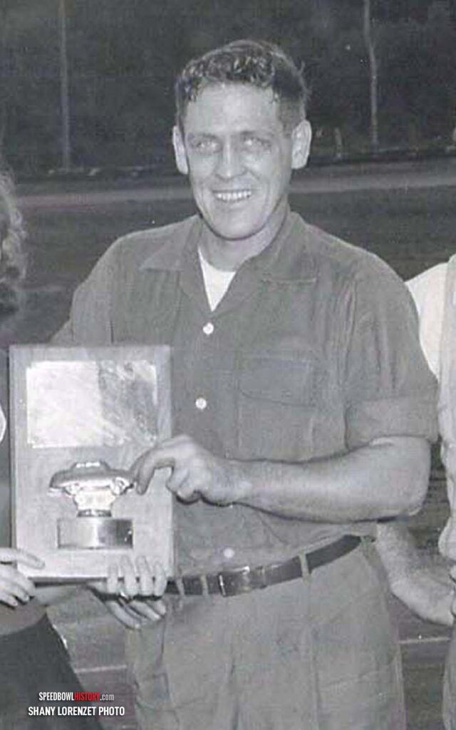 Black and white abstract pattern with concentric circles and wave shapes.