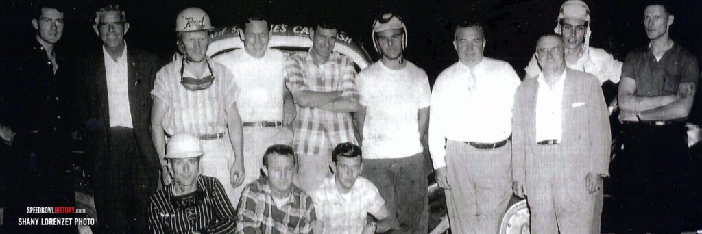 Black and white abstract pattern with concentric circles and wave shapes.