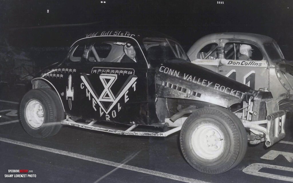 Black and white abstract pattern with concentric circles and wave shapes.