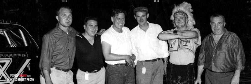 Black and white abstract pattern with concentric circles and wave shapes.