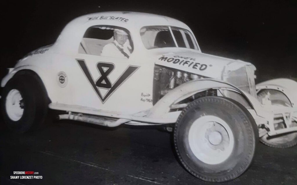 Black and white abstract pattern with concentric circles and wave shapes.