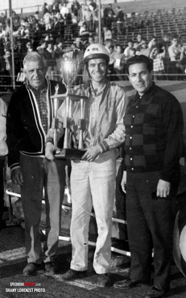 Black and white abstract pattern with concentric circles and wave shapes.