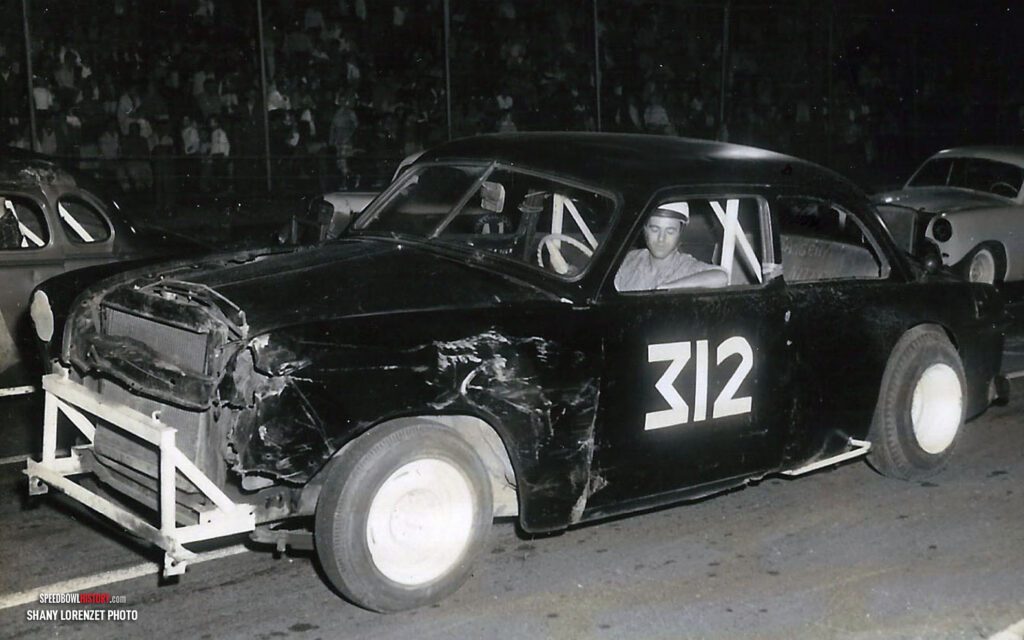 Black and white abstract pattern with concentric circles and wave shapes.