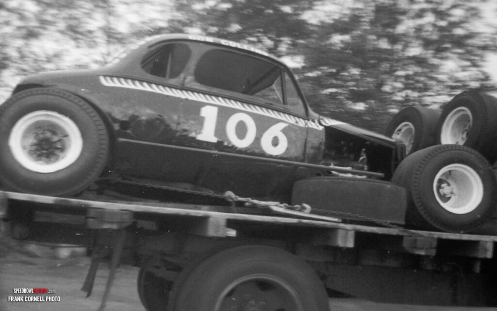 Black and white abstract pattern with concentric circles and wave shapes.