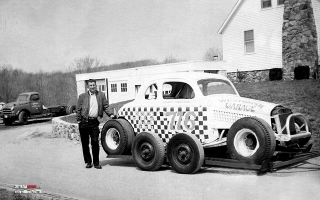 Black and white abstract pattern with concentric circles and wave shapes.