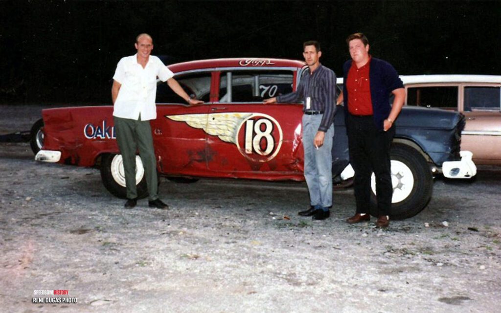 Black and white abstract pattern with concentric circles and wave shapes.