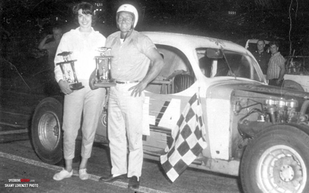 Black and white abstract pattern with concentric circles and wave shapes.