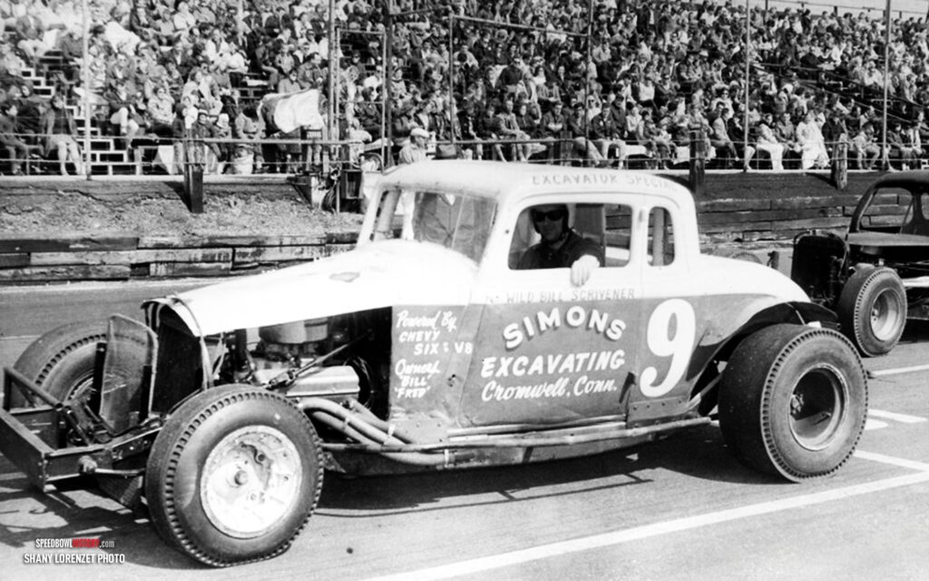 Black and white abstract pattern with concentric circles and wave shapes.