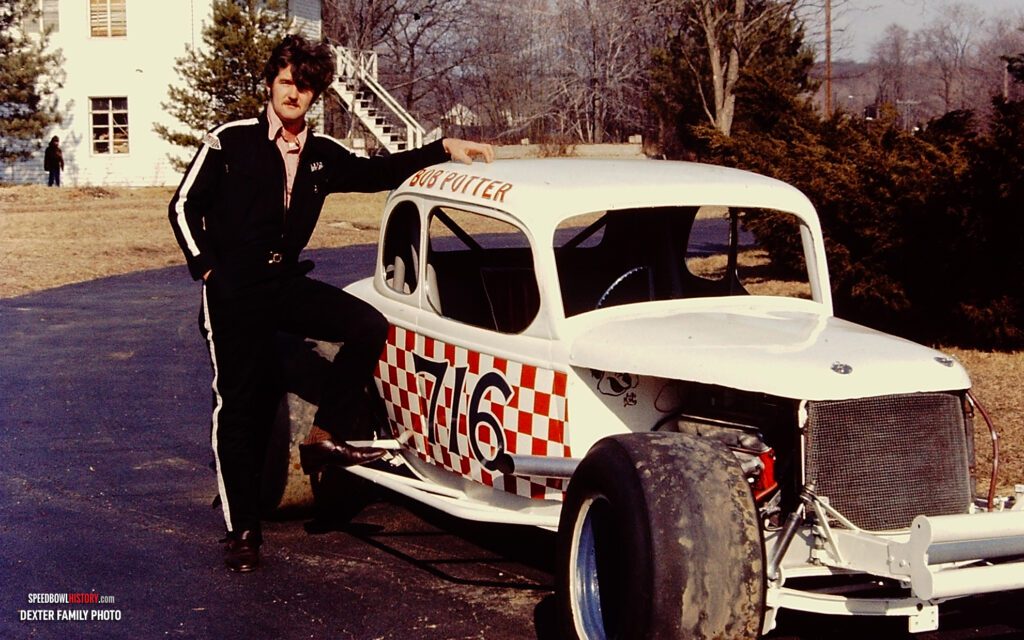Black and white abstract pattern with concentric circles and wave shapes.