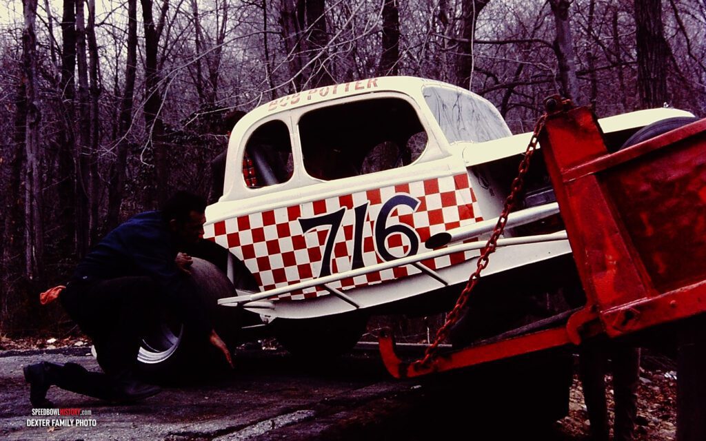 Black and white abstract pattern with concentric circles and wave shapes.