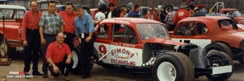 Black and white abstract pattern with concentric circles and wave shapes.