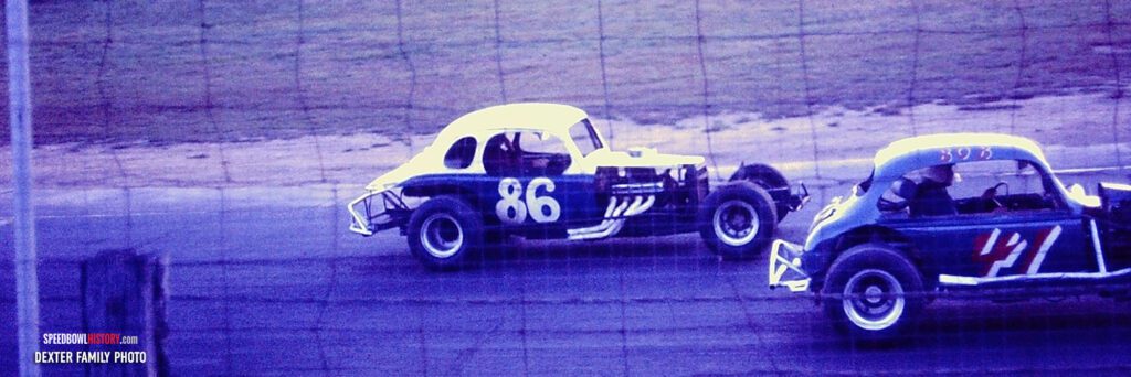 Black and white abstract pattern with concentric circles and wave shapes.