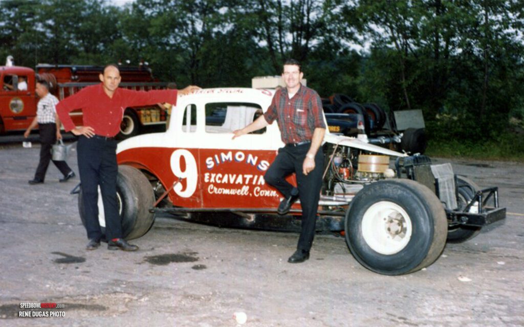 Black and white abstract pattern with concentric circles and wave shapes.