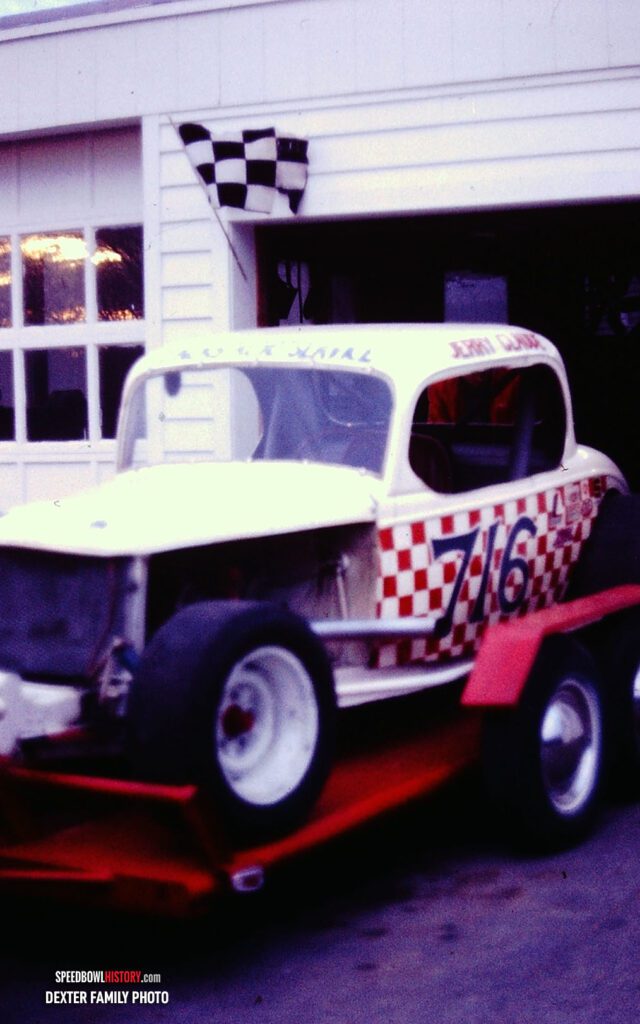 Black and white abstract pattern with concentric circles and wave shapes.