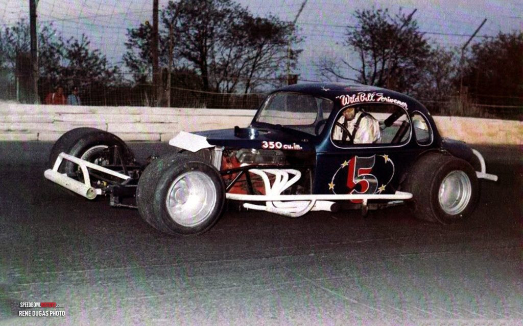 Black and white abstract pattern with concentric circles and wave shapes.