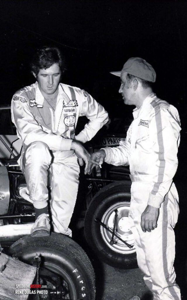 Black and white abstract pattern with concentric circles and wave shapes.