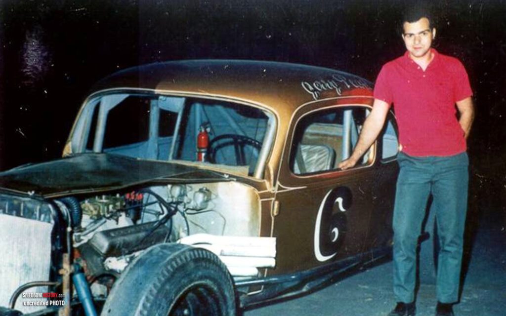 Black and white abstract pattern with concentric circles and wave shapes.