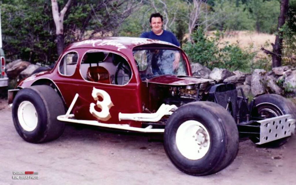 Black and white abstract pattern with concentric circles and wave shapes.