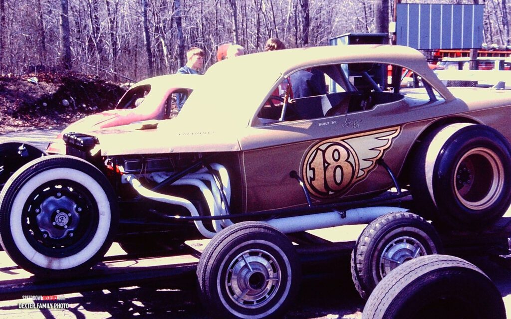 Black and white abstract pattern with concentric circles and wave shapes.