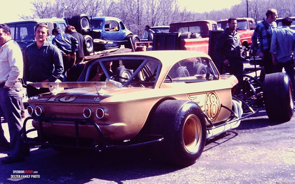 Black and white abstract pattern with concentric circles and wave shapes.