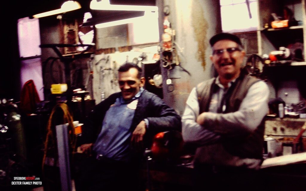 Black and white abstract pattern with concentric circles and wave shapes.