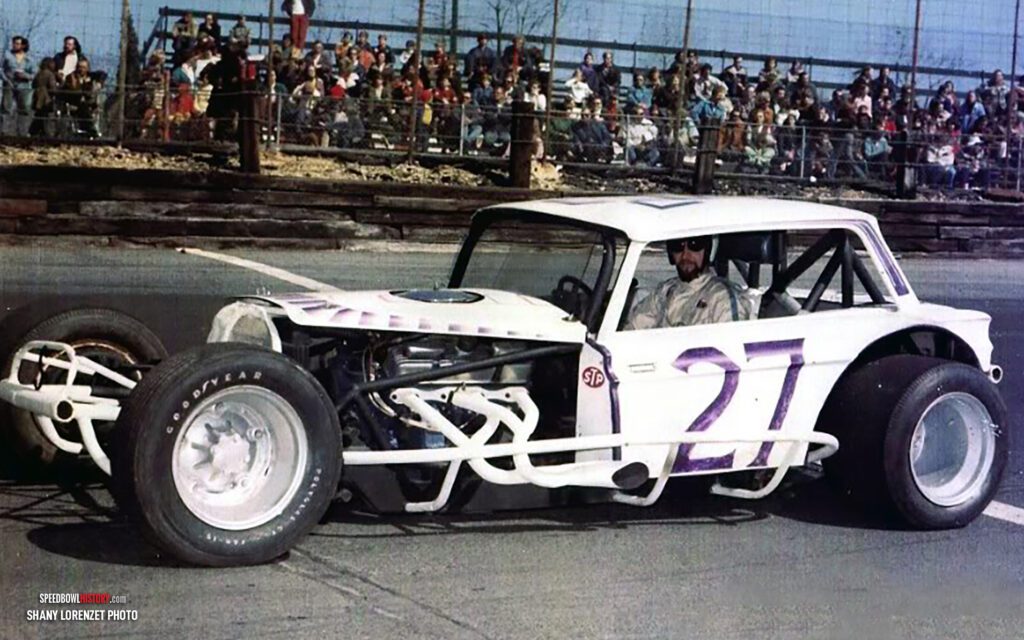 Black and white abstract pattern with concentric circles and wave shapes.