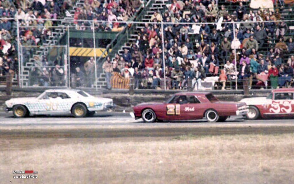 Black and white abstract pattern with concentric circles and wave shapes.