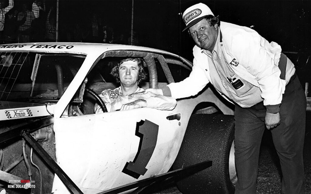 Black and white abstract pattern with concentric circles and wave shapes.