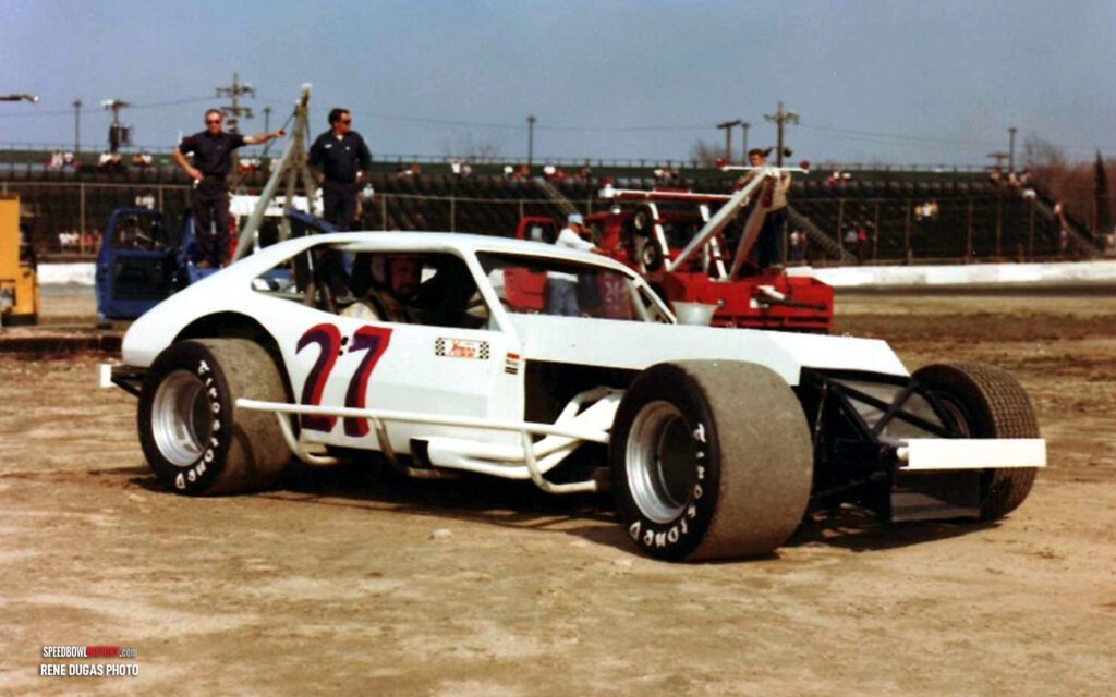 Black and white abstract pattern with concentric circles and wave shapes.