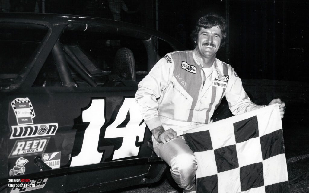 Black and white abstract pattern with concentric circles and wave shapes.