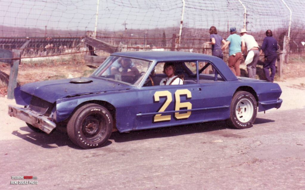 Black and white abstract pattern with concentric circles and wave shapes.