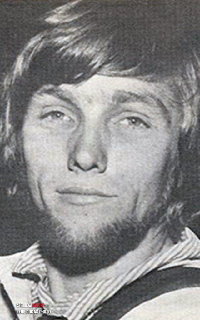 Black and white abstract pattern with concentric circles and wave shapes.