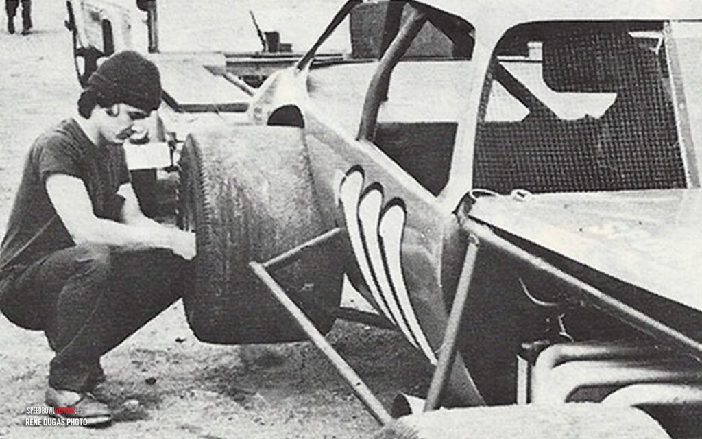 Black and white abstract pattern with concentric circles and wave shapes.