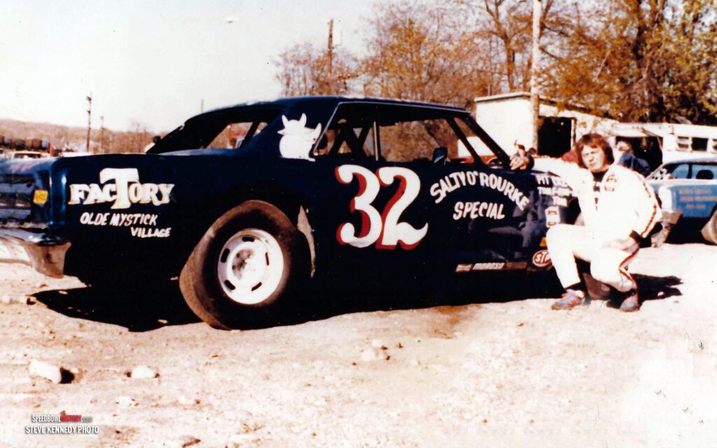 Black and white abstract pattern with concentric circles and wave shapes.