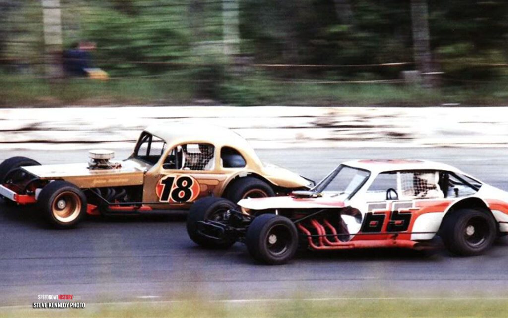 Black and white abstract pattern with concentric circles and wave shapes.