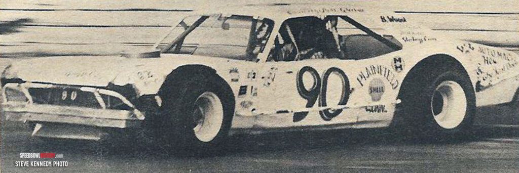 Black and white abstract pattern with concentric circles and wave shapes.