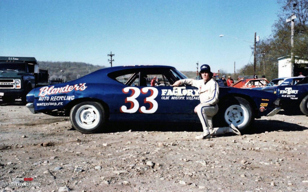Black and white abstract pattern with concentric circles and wave shapes.