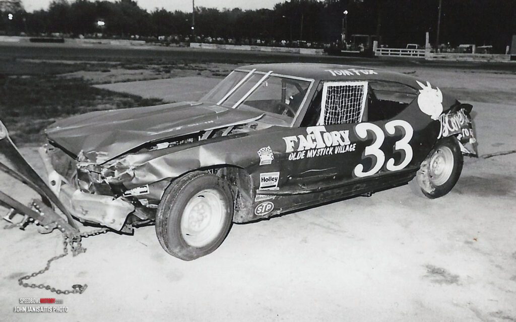 Black and white abstract pattern with concentric circles and wave shapes.