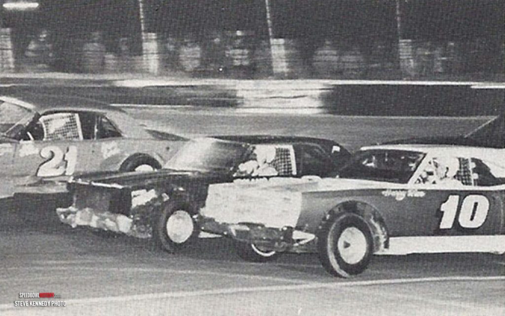 Black and white abstract pattern with concentric circles and wave shapes.