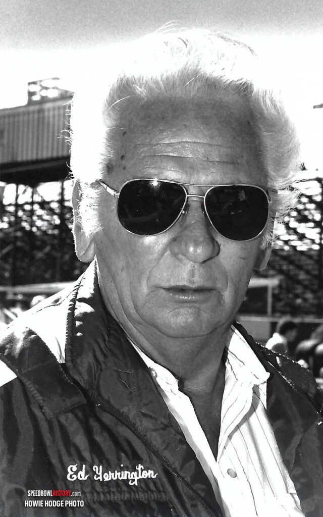 Black and white abstract pattern with concentric circles and wave shapes.