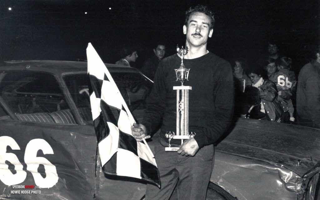 Black and white abstract pattern with concentric circles and wave shapes.